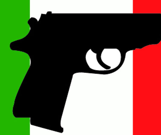 Fidasc sul recepimento della Direttiva armi: “Moderata soddisfazione” Pistola su bandiera italiana