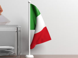 Referendum propositivo: la posizione delle associazioni venatorie Referendum propositivo la posizione delle associazioni venatorie: bandiera italiana accanto a urna