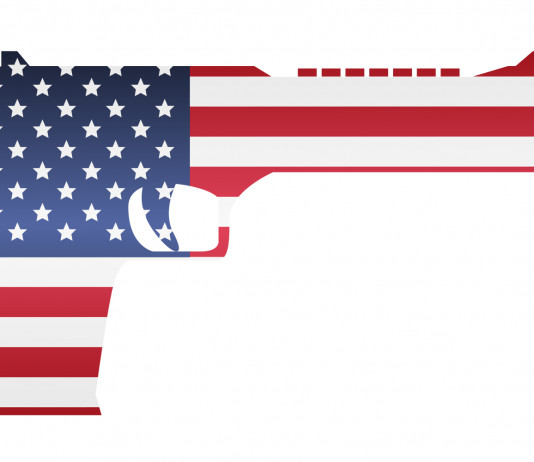 Mercato delle armi in America: ecco i numeri a settembre Mercato delle armi in America: pistola con bandiera americana