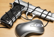 Anagrafe digitale dei possessori di armi, interrogazione al Senato Anagrafe digitale dei possessori di armi, interrogazione al Senato: pistola avvolta in filo del mouse